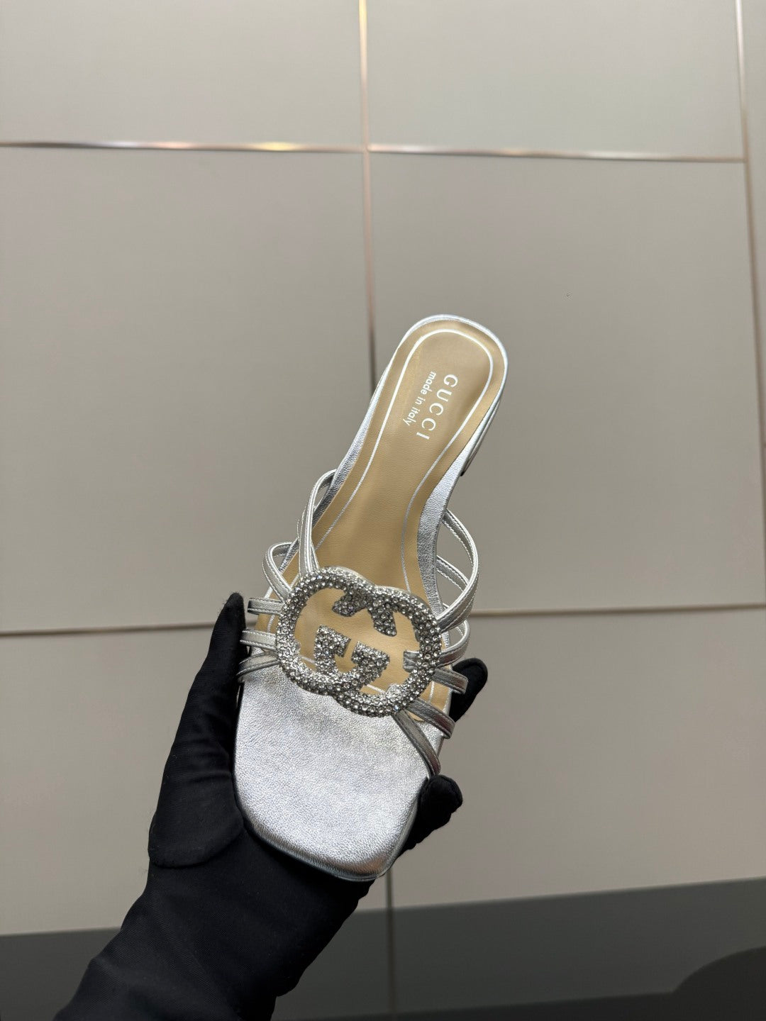 Gucci ladies silver crystal slides, close-up of jeweled bow at the top