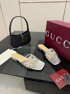Gucci ladies silver crystal mule slides with bow embellishment and cushioned footbed