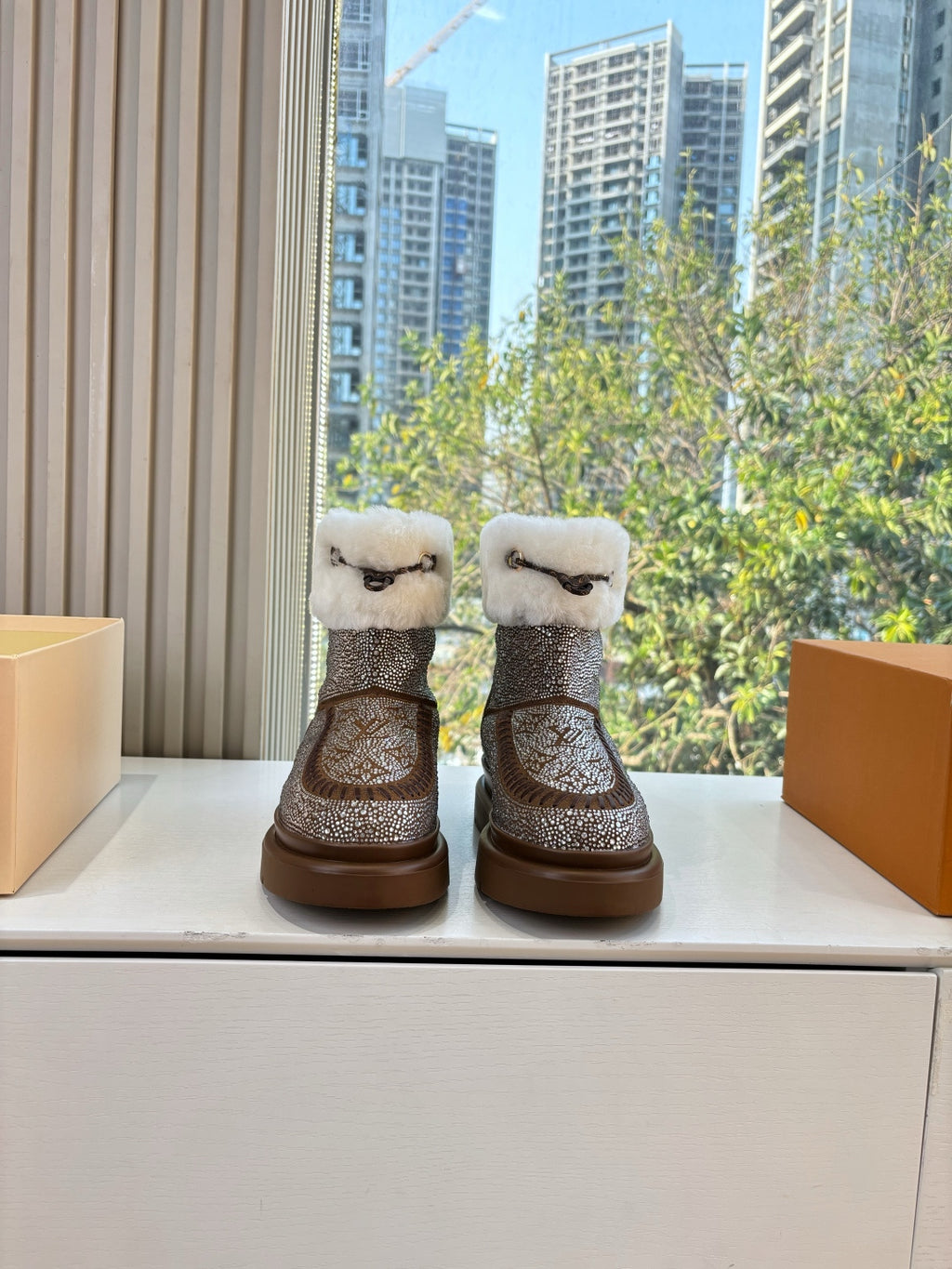Embellished ankle boots with white shearling cuffs and brown glitter finish