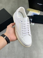 White lace-up sneakers, perforated toe and side panels, low-profile rubber sole