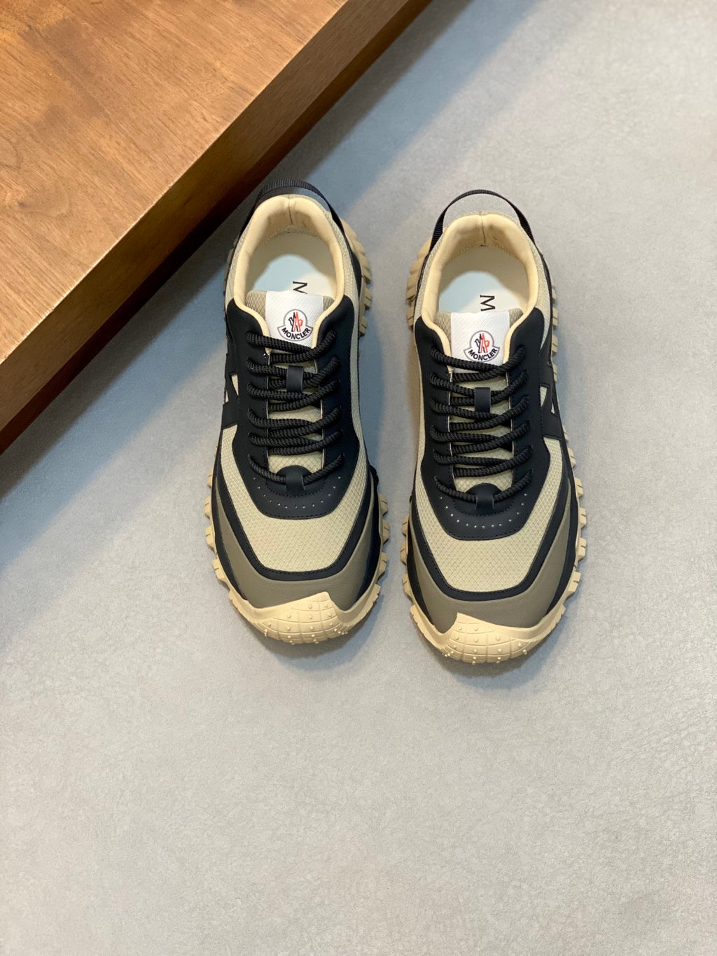 Moncler low-top sneakers in dark navy with beige trim and chunky rubber sole