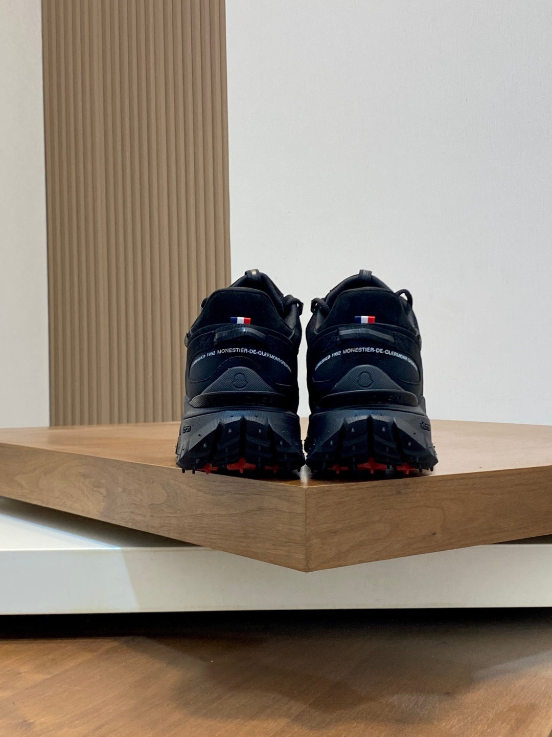 Moncler luxury lace-up shoes back view with rear tabs and rugged tread outsole