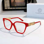 Red square eyeglasses with gold temple logo detail and clear lenses