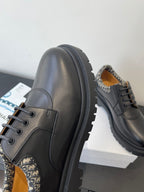 Dior lace-up shoes, dark leather side panel with patterned lining detail