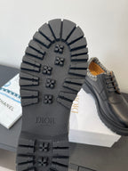 Dior shoes outsole with rugged tread and raised Dior logo
