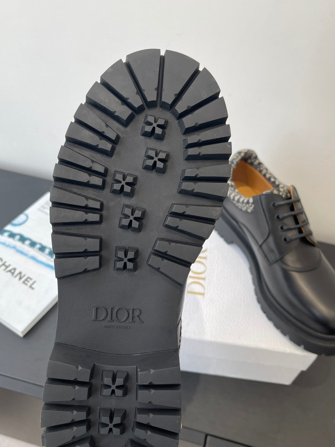 Dior shoes outsole with rugged tread and raised Dior logo