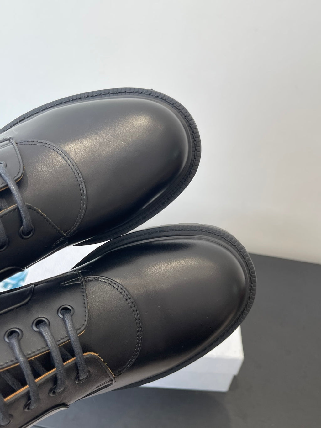 Dior unisex lace-up shoes, close-up of dark leather toe and side seam stitching