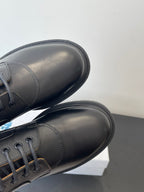 Dior unisex lace-up shoes, close-up of dark leather toe and side seam stitching