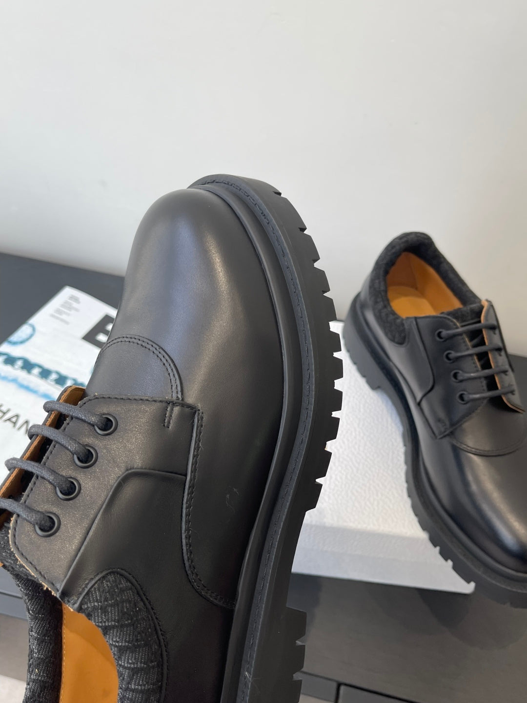 Dior unisex lace-up shoes, dark leather side panels with visible stitching and thick sole