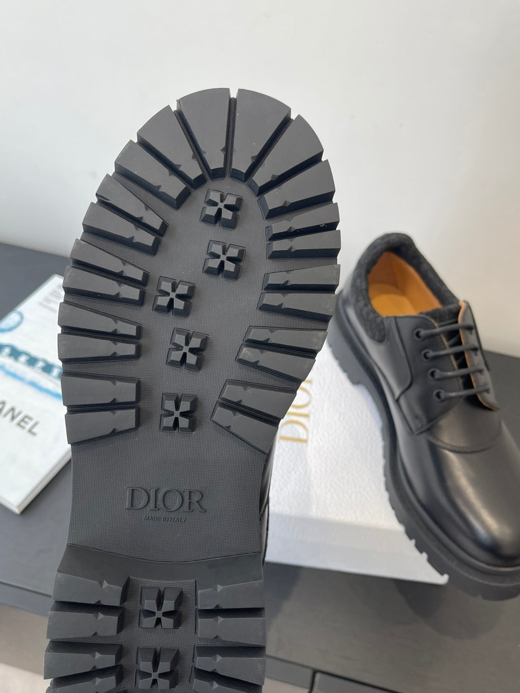 Dior unisex shoes, outsole view with DIOR text and rugged tread pattern