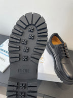 Dior unisex shoes, outsole view with DIOR text and rugged tread pattern