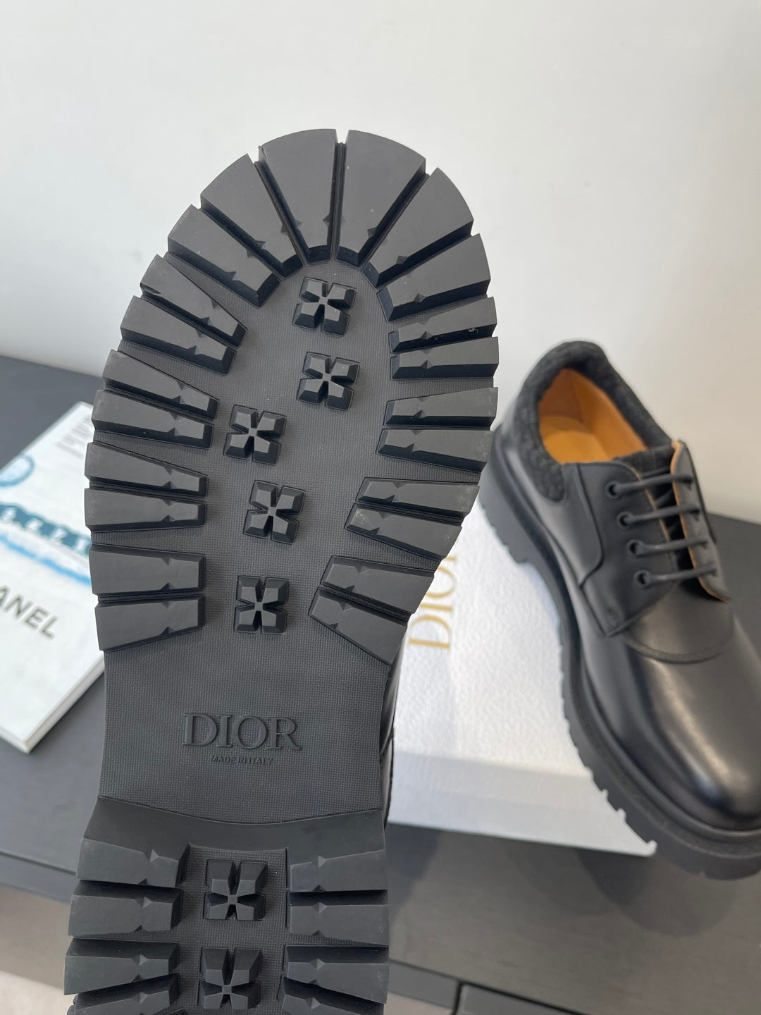 Dior unisex shoes, outsole view with DIOR text and rugged tread pattern