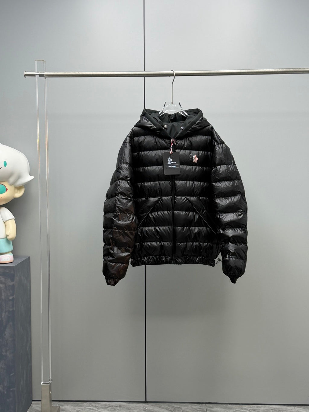 Long Moncler puffer jacket, black, zip-front with hood and small chest logo
