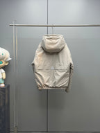 Light beige long puffer jacket back view with ribbed hem cuffs and hood