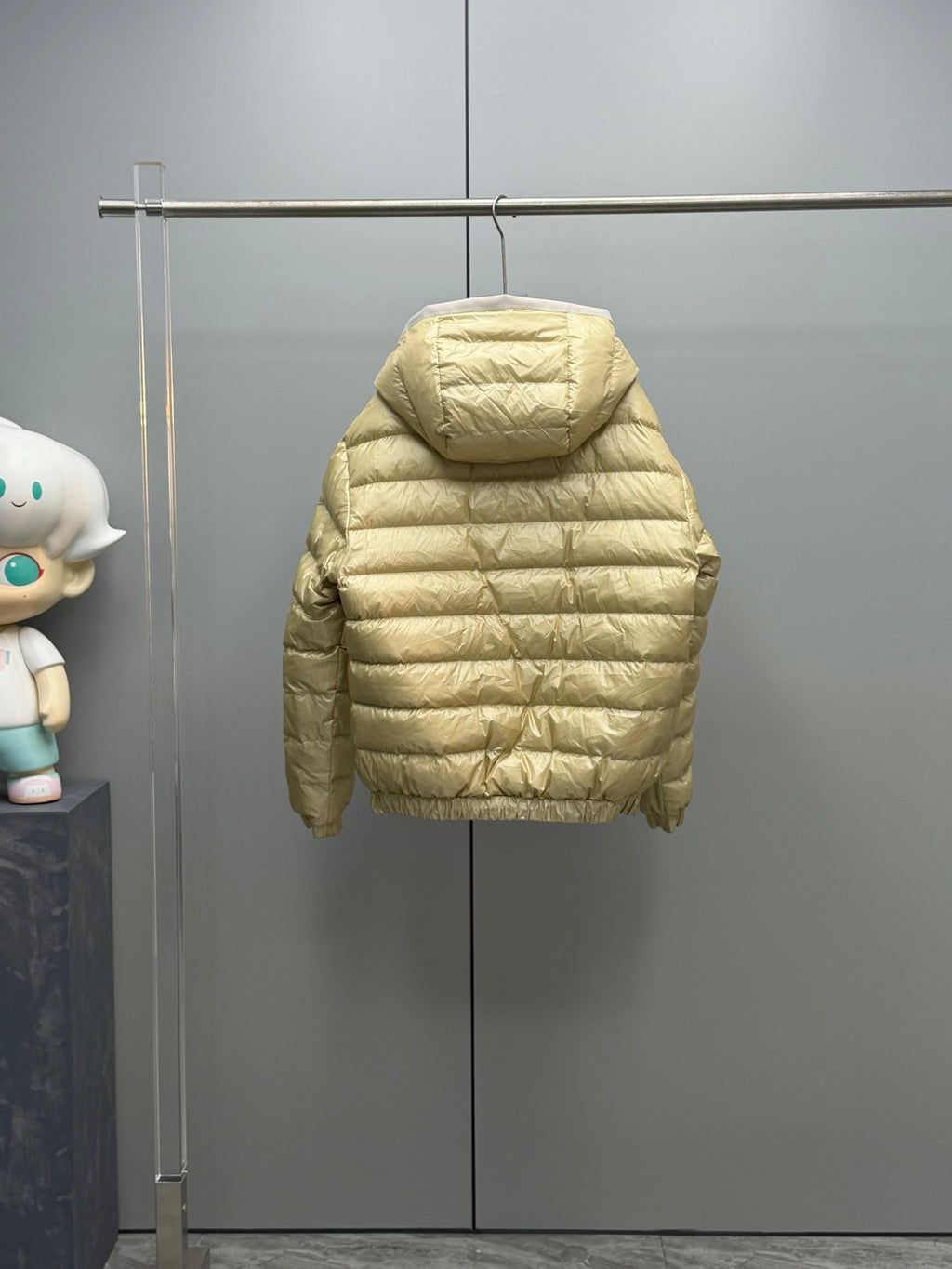 Long Moncler puffer jacket, light gold back view with full hood and quilted sleeves