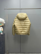 Long Moncler puffer jacket, light gold back view with full hood and quilted sleeves