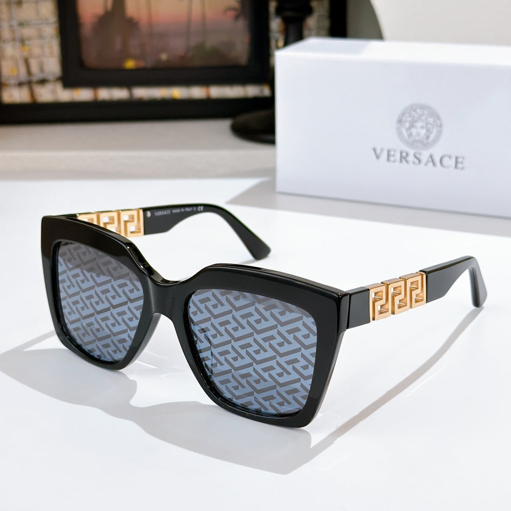 Black square sunglasses with gold temple emblem and gray patterned lenses