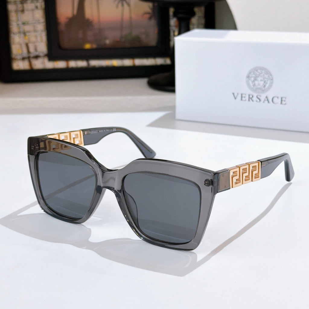 Gray square sunglasses with gold temple detail and dark tinted lenses