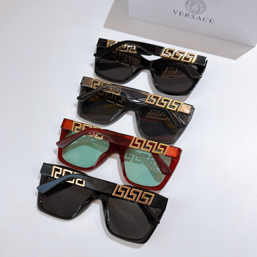 Four sunglasses in mixed colors—black and red—with gold temple accents