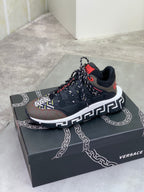 Versace lace-up sneaker in black with white Greek key trim on midsole and red detail