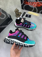 Versace sneakers pair, angled view with turquoise upper, purple accents, black laces and sole