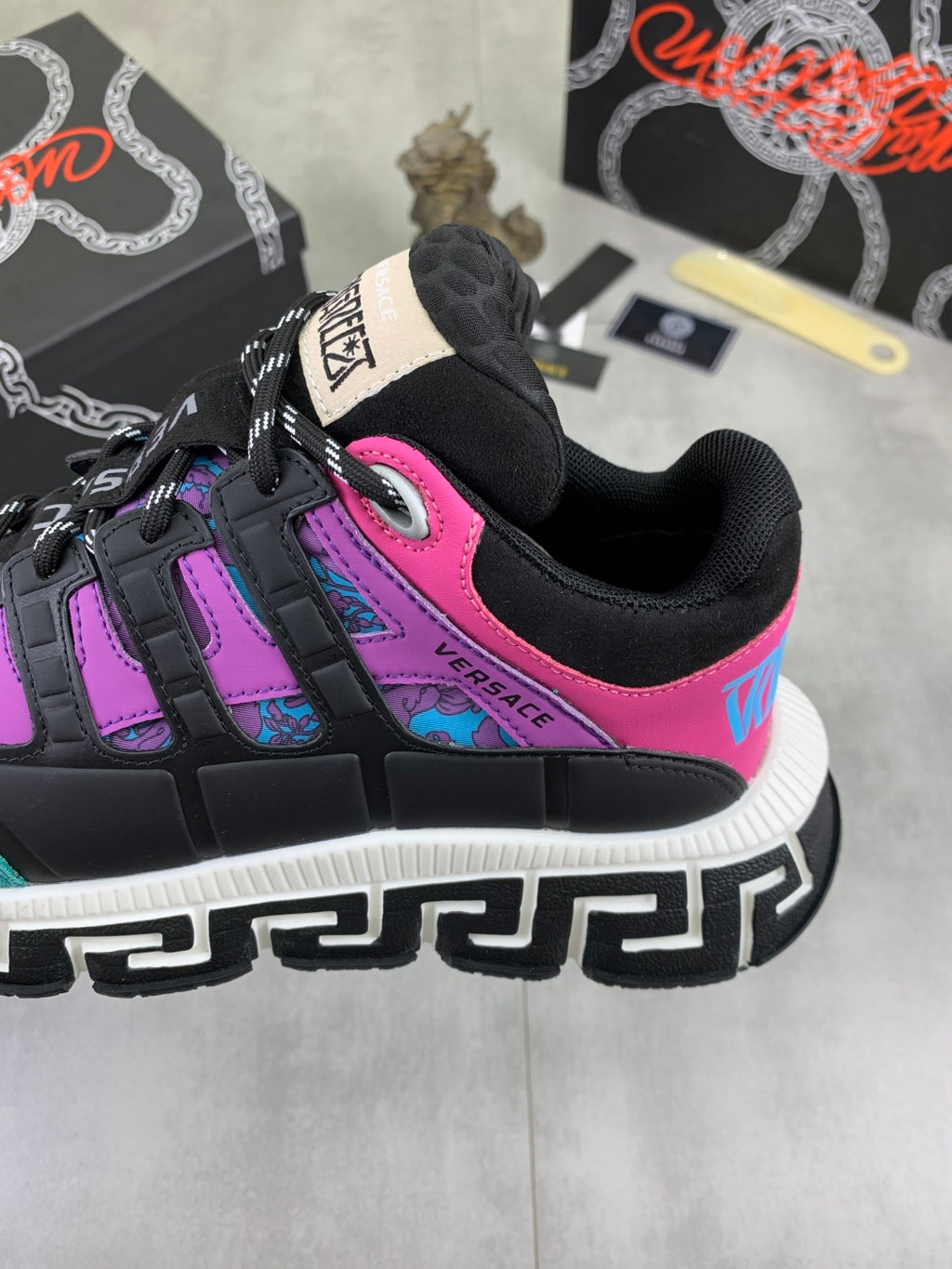 Versace sneakers heel detail, black mesh and leather with neon pink stripe and teal accents