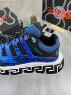 Blue and black Versace sneakers heel and side detail with white Greek key sole trim
