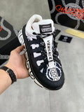Versace sneakers in black and white with chunky sole, lace-up front, and logo details