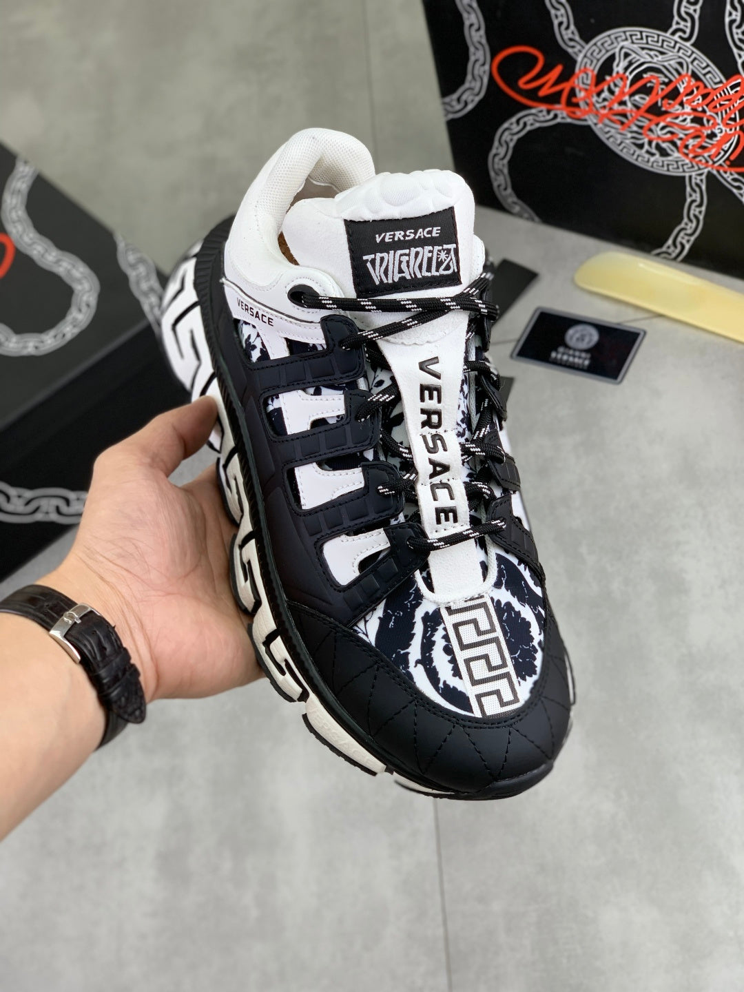 Versace sneakers in black and white with chunky sole, lace-up front, and logo details