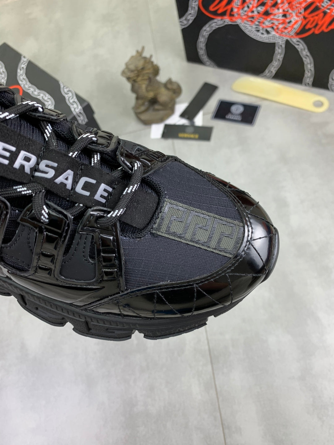Versace luxury sneaker toe, black leather with blue insert and lace-up front
