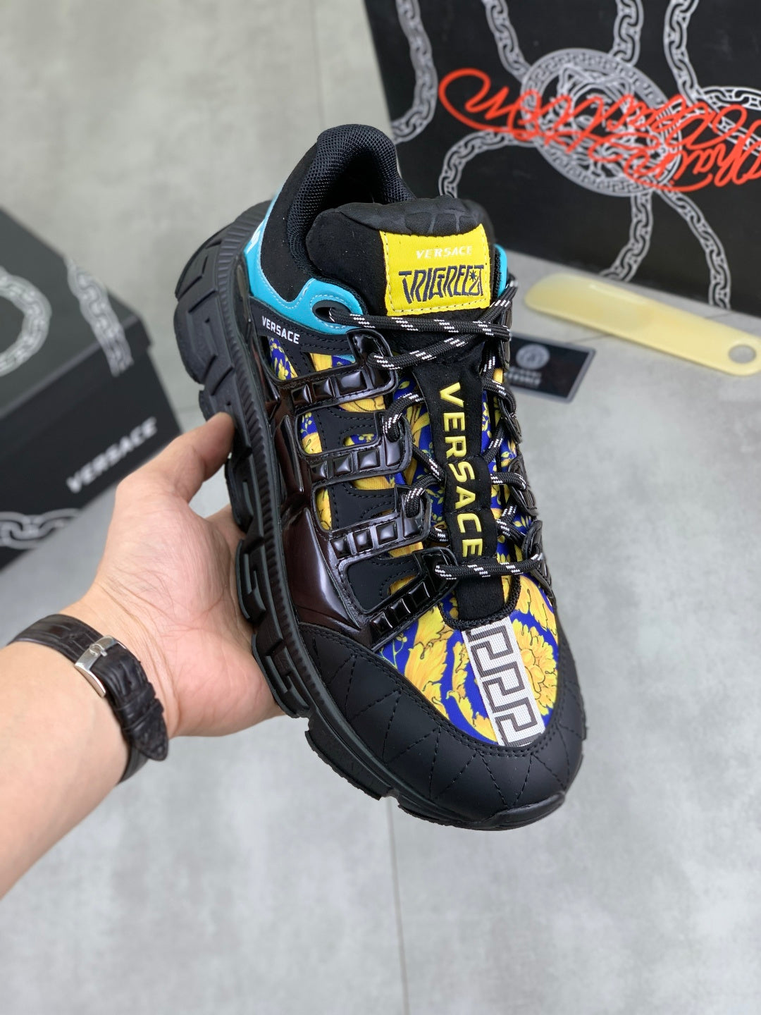 Versace sneakers, black with blue and yellow logo panels, chunky tread sole