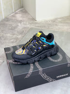 Versace black lace-up sneakers with blue heel trim and colorful yellow graphic patch