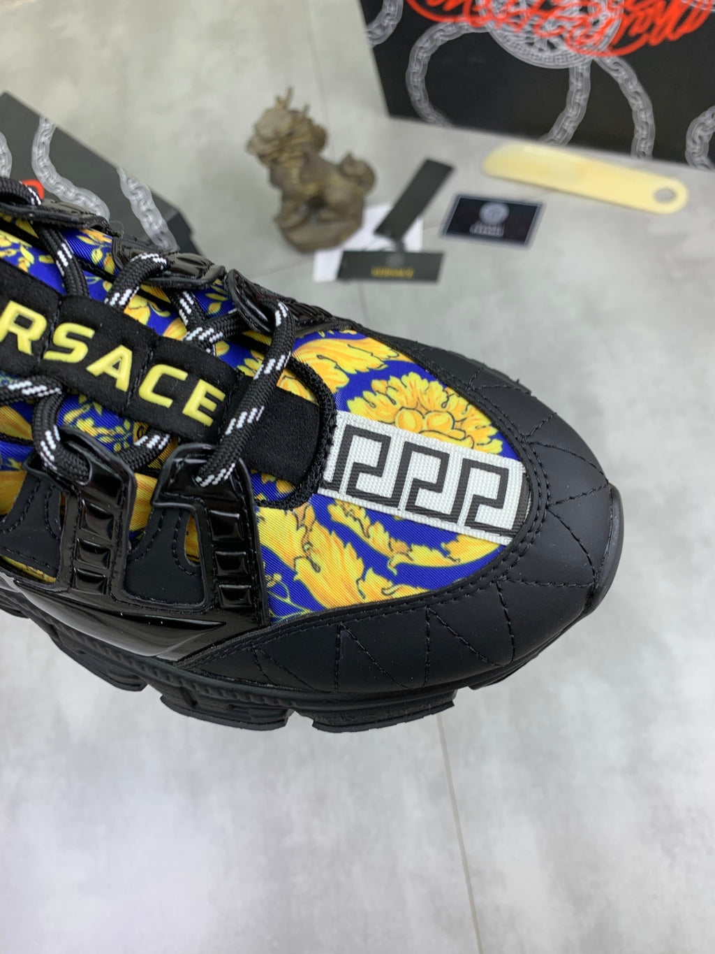 Versace black sneaker toe with bold blue and yellow emblem panel