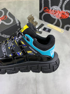 Versace black sneaker with bright blue collar and yellow-trimmed side graphic