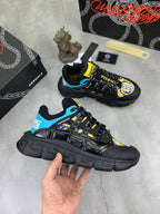 Sneakers, black uppers with bright blue lining and yellow accents, thick lug sole