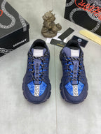 Versace luxury sneakers pair, dark navy upper with bright blue accents and laces
