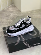 Black and white Versace low-top sneakers with mesh upper and white platform sole