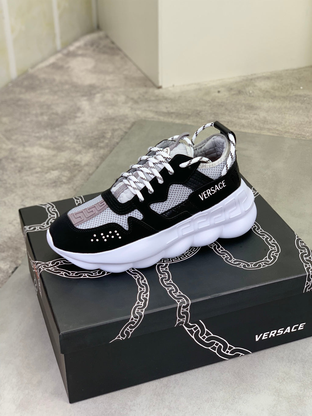 Versace low-top sneakers, black and white with white midsole and lace-up front
