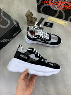 Black and white Versace sneakers with white platform sole and lace-up closure
