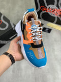 Versace sneakers with blue, orange, and black panels, white laces and thick white sole