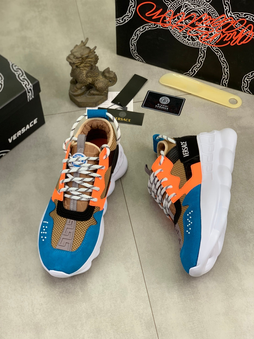 Versace sneakers with blue, orange, black upper and white outsole, side view