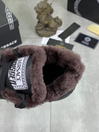 Versace dark gray sneaker opening with faux-fur lining and logo patch