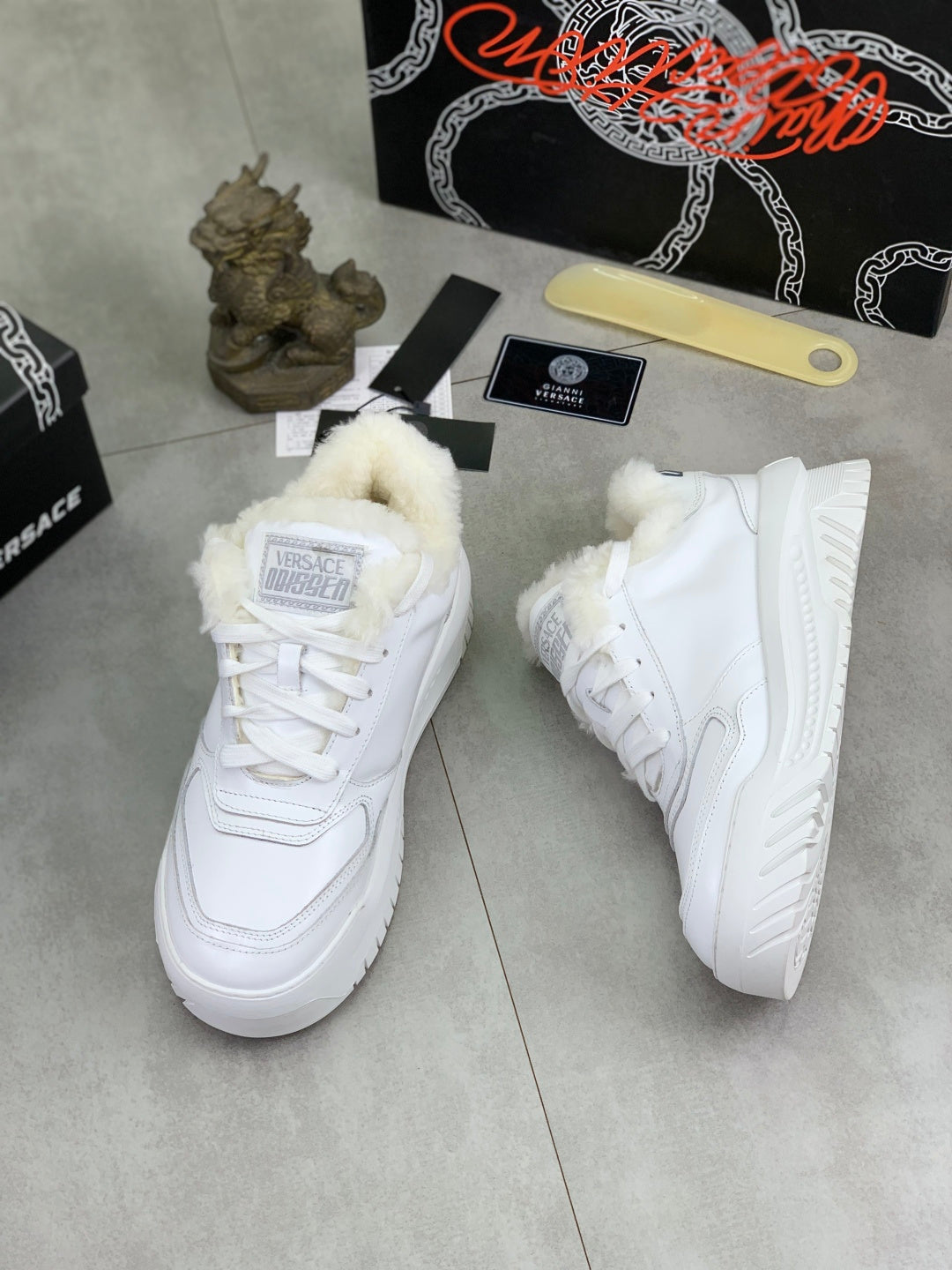 Versace white leather sneakers with high fuzzy cuffs and lace-up design