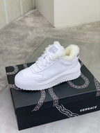 Versace white lace-up sneaker with fuzzy collar on a black box