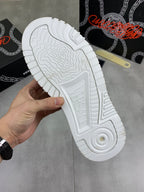Versace white sneaker outsole view with tread and circular logo insert