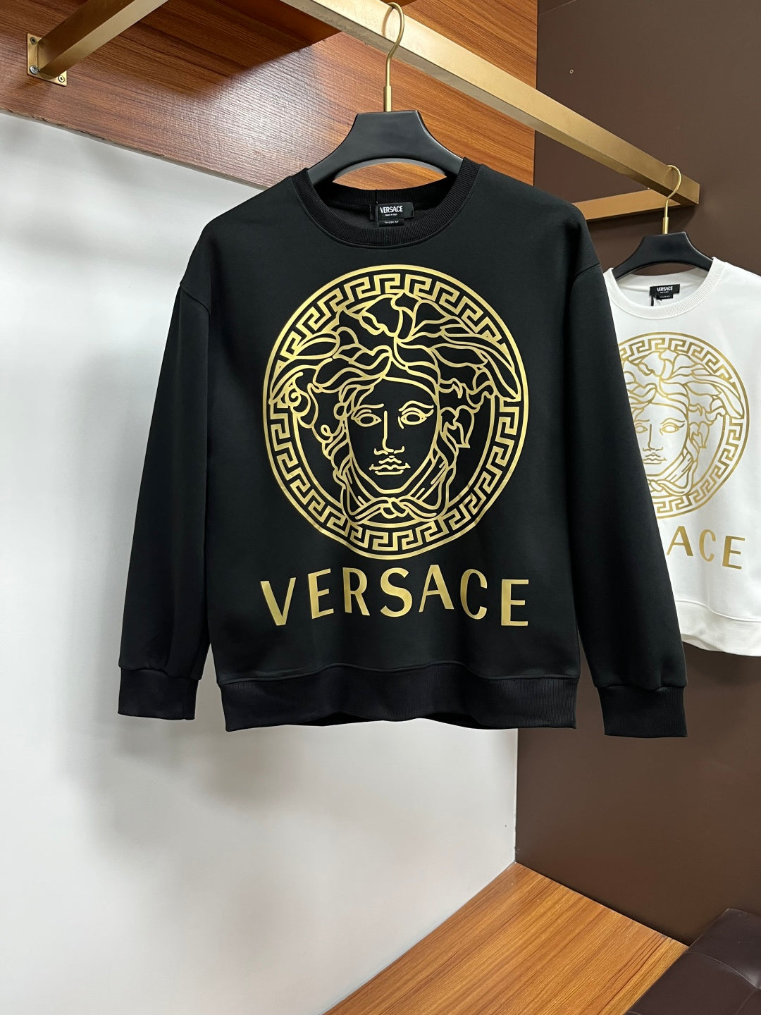 Versace crewneck sweatshirt, black with gold Medusa front graphic and logo text