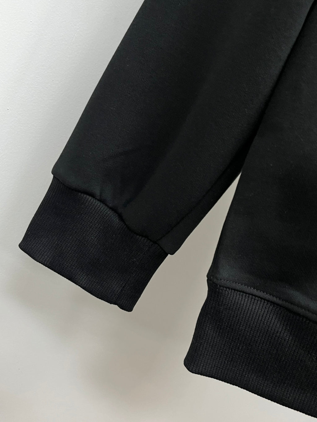Versace crewneck sweatshirt sleeve and cuff, black knit trim