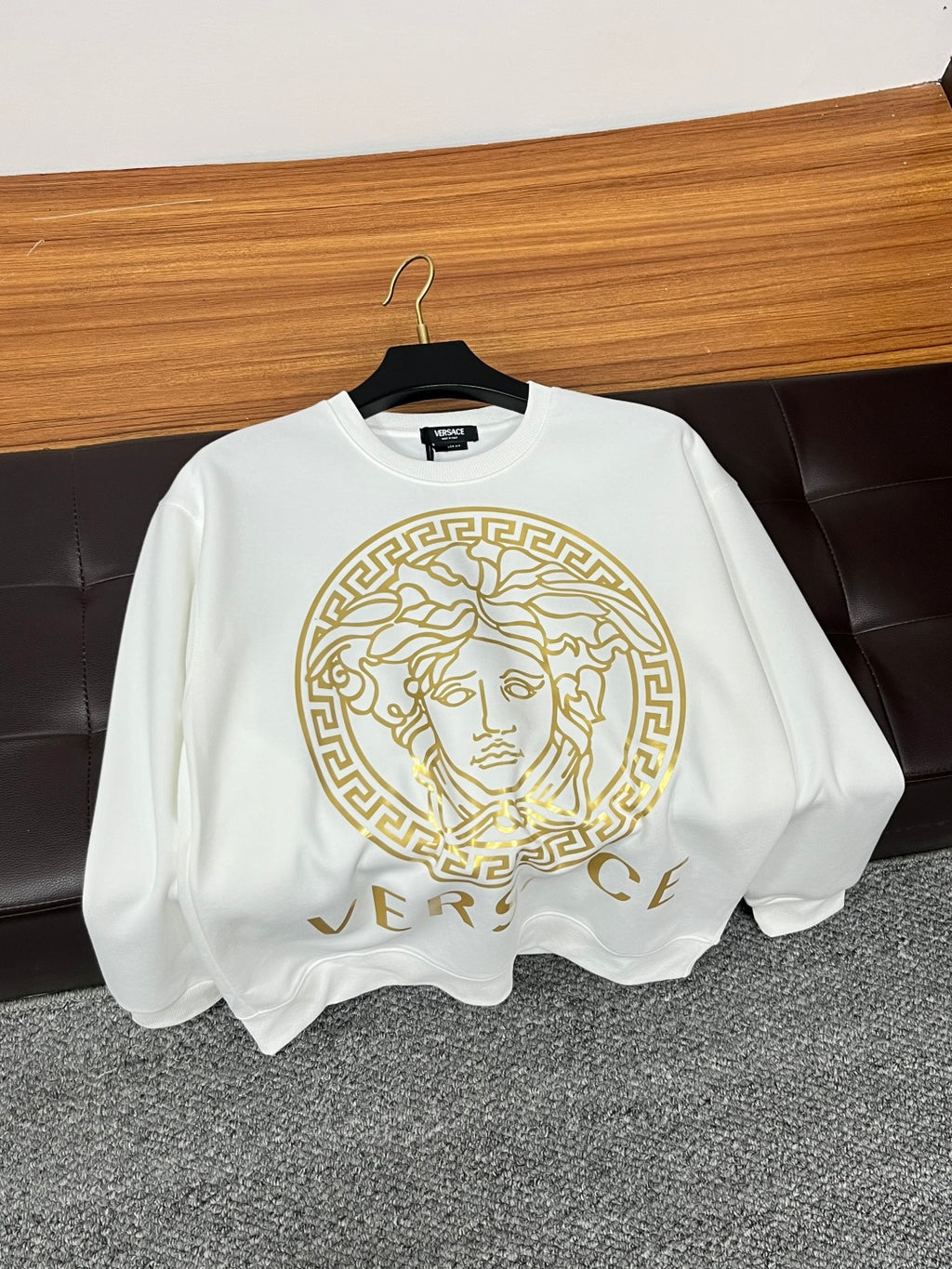White crewneck sweatshirt hanging with gold Medusa emblem and partial VERSACE lettering
