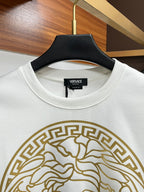 White crewneck sweatshirt with ribbed collar and gold Medusa emblem detail