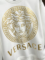White crewneck sweatshirt with large gold Medusa emblem and VERSACE text